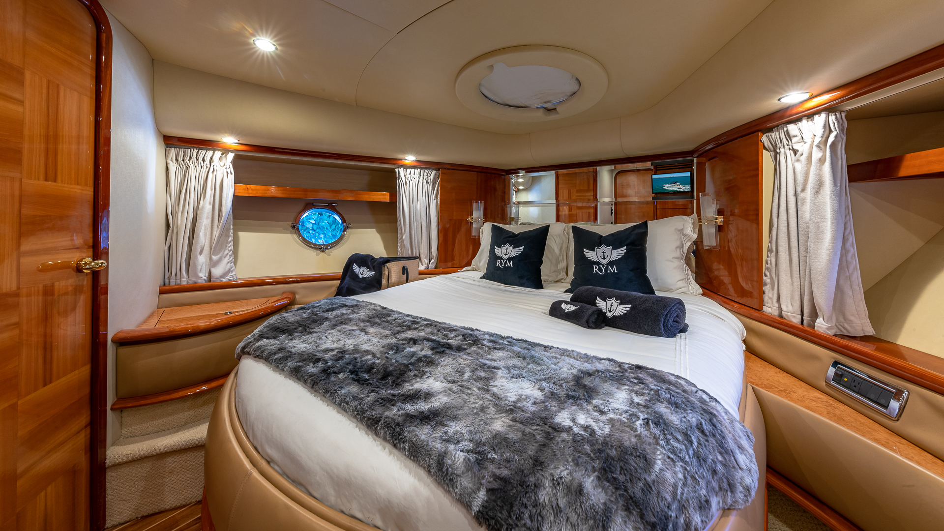 65-foot Azimut luxury yacht — bow seating and sunpad