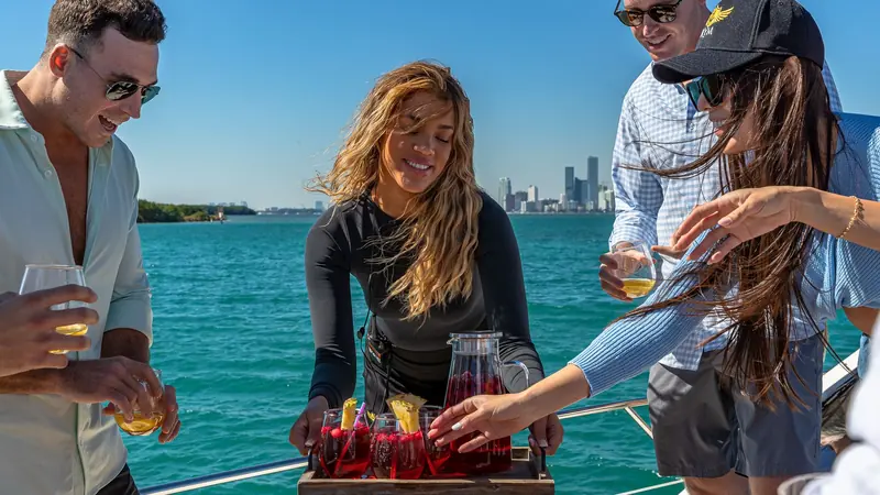 Crew serving drinks to guests on the Azimut L'chaim