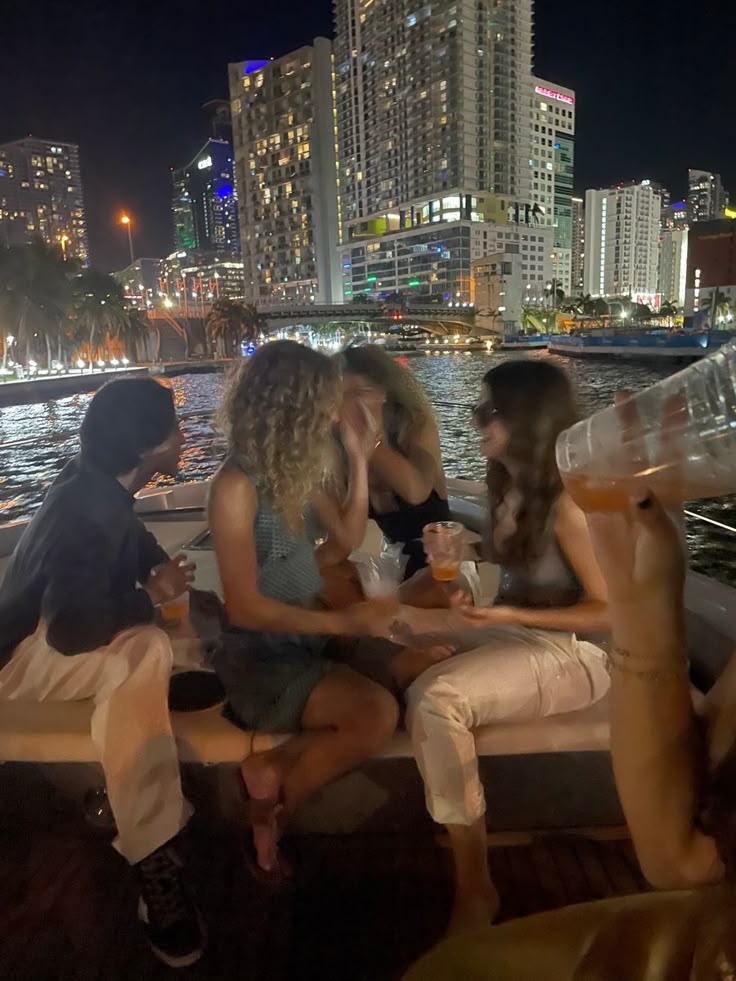Guests enjoying a sunset charter as Miami lights come on