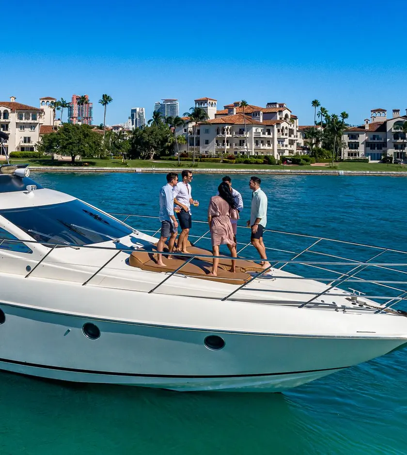 Guests on the bow of the Azimut L'chaim off Fisher Island