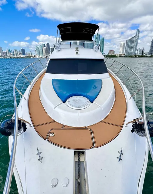 Bow of the Isabella 48 yacht facing the Miami skyline